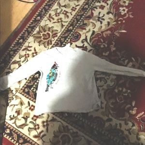 I am selling a t-shirt with a bird on it